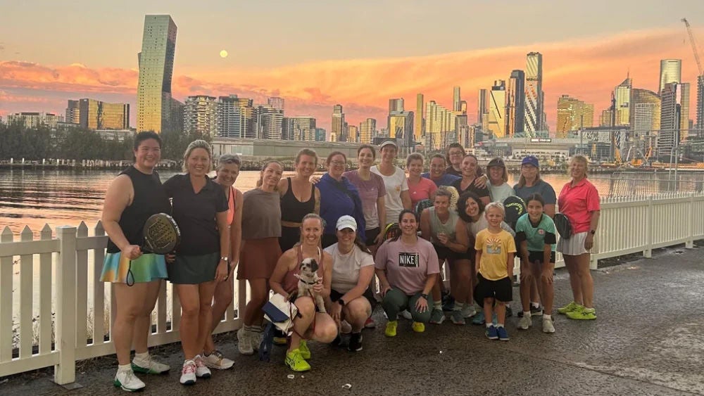 A group of women and girl Padel Players standing together in Melbourne's Docklands
